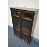 A MAHOGANY GLAZED TWO DOOR BOOKCASE, width 84cm x depth 34cm x height 128cm