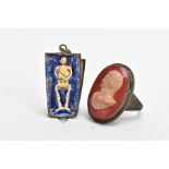 A WHITE METAL CAMEO RING AND A PENDANT, the ring of an oval form, stone cameo depicting a