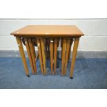 A MID CENTURY POUL HUNDEVAD TEAK NEST OF TABLES, with four circular fold out tables, width 62cm x