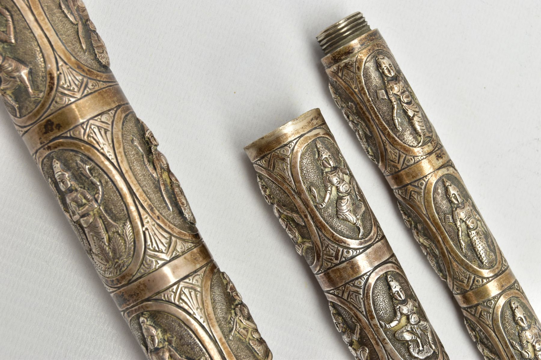 AN ASIAN WHITE METAL WALKING CANE, embossed religious figures throughout, can be taken apart into - Image 3 of 7