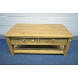 AN OAK EFFECT COFFEE TABLE, with two drawers, width 113cm x depth 60cm x height 46cm