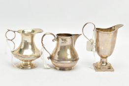 THREE SILVER MILK JUGS, each in a different form fitted with scrolling handles, each with a full