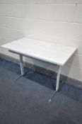 A FORMICA TOPPED TABLE, on a metal base, width 107cm x depth 60cm x height 72cm