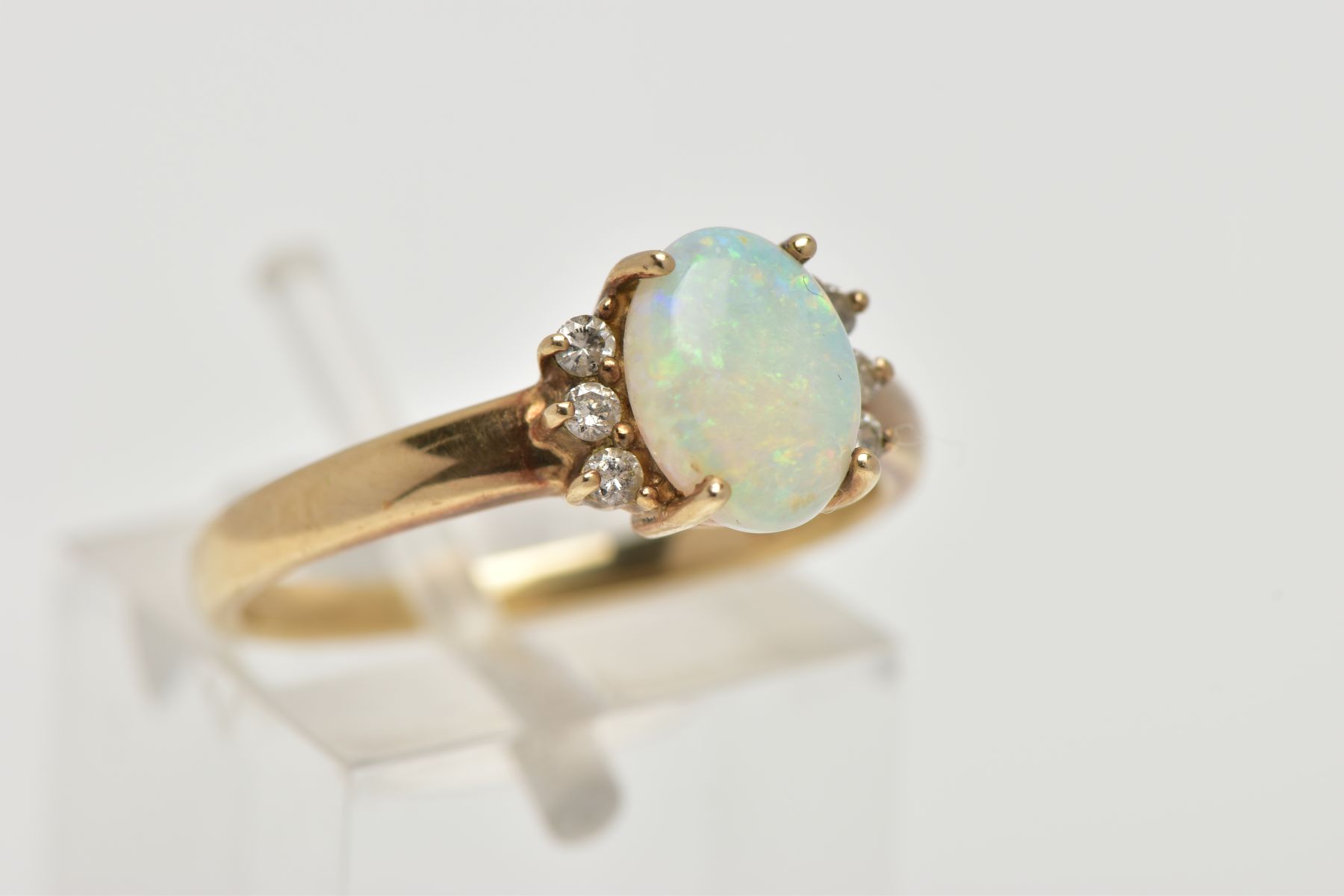 A 9CT GOLD OPAL AND DIAMOND RING, centring on a four claw set oval white opal cabochon, showing - Image 4 of 4