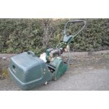 AN ATCO ENSIGN B17 PETROL CYLINDER MOWER with grass box and aerator attachment (engine pulls and