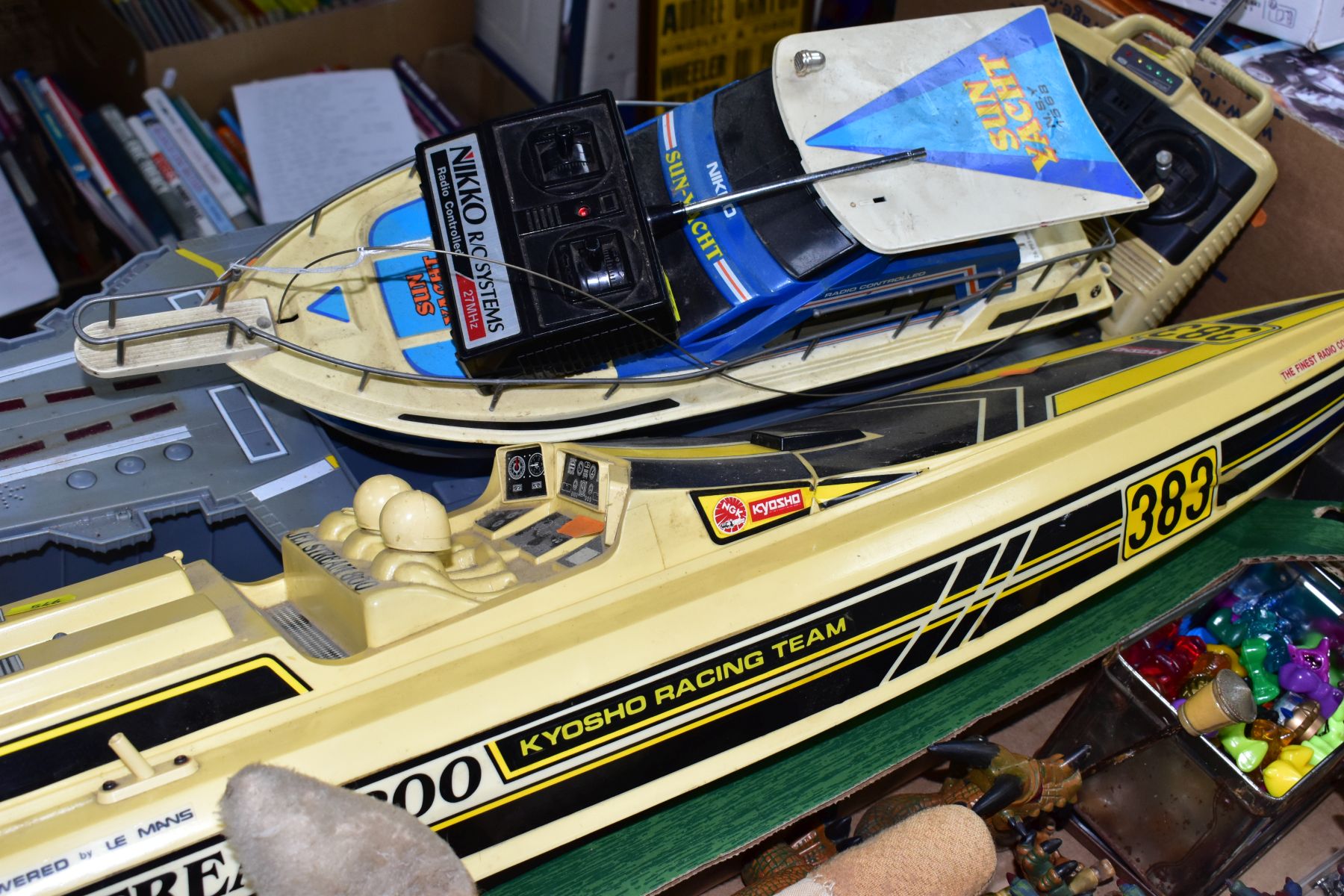 A BOX OF ASSORTED TOYS AND TWO RADIO CONTROLLED BOATS AND A BATTERY OPERATED SHIP, the toys to - Image 7 of 8