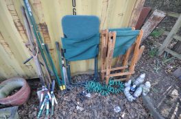A PAIR OF PINE FOLDING GARDEN CHAIRS, another metal framed folding garden chair, various garden