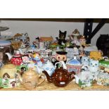 THIRTY SIX NOVELTY AND OTHER TEAPOTS, to include a Cardew Designs washstand teapot, a Portmeirion