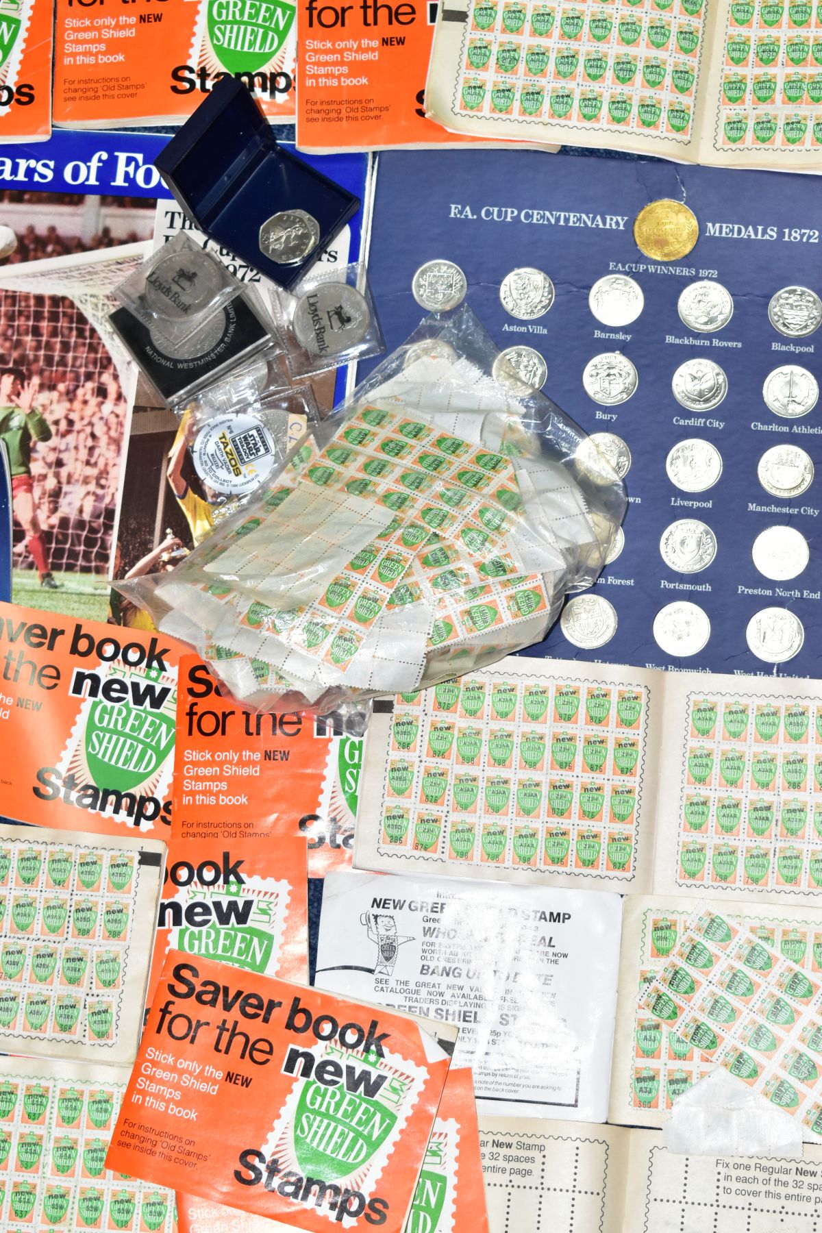 A BOX OF COMMEMORATIVE COINS, GREEN SHIELD SAVER STAMPS AND BOOKS, ETC, including a 2006 VC fifty