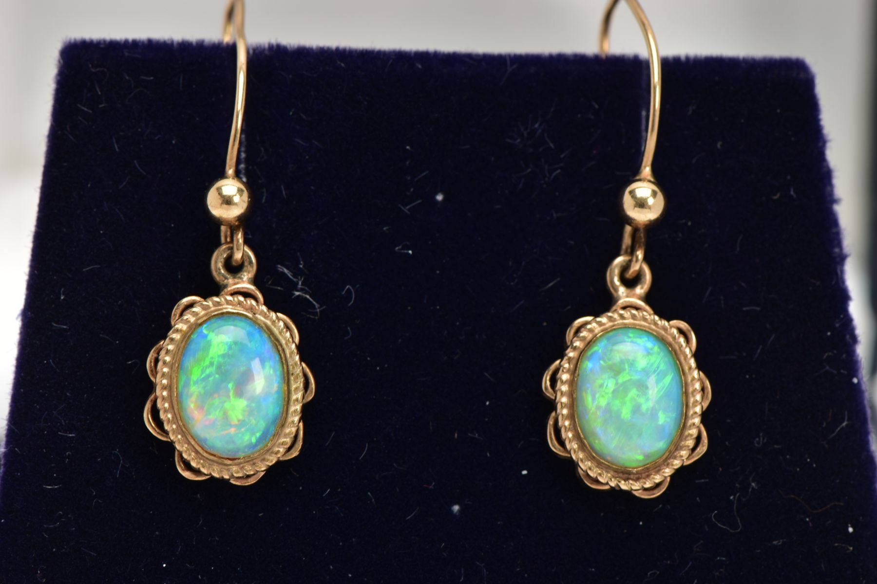 A PAIR OF OPAL CABOCHON DROP EARRINGS, yellow metal drop earrings each of an oval form, oval white
