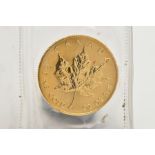 A GOLD CANADIAN 20 DOLLAR COIN, signed 'Canada fine gold half oz or pur coin', detailing a maple