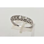 AN 18CT WHITE GOLD DIAMOND RING, designed with a row of seven round brilliant cut diamonds,