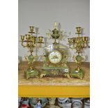 A LATE 19TH CENTURY ONYX AND GILT METAL CLOCK GARNITURE, the clock with urn shaped finial above an