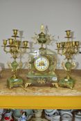 A LATE 19TH CENTURY ONYX AND GILT METAL CLOCK GARNITURE, the clock with urn shaped finial above an