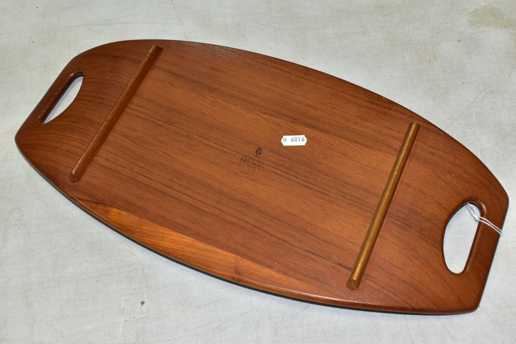 A 1960s DANSK TEAK TRAY, designed by Jens Quistgaard, an oval two handled tray, with side rails - Image 3 of 4