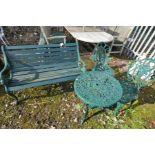 A CAST ALUMINIUM ENDED GARDEN BENCH with scrolled lion mask ends, wooden slatted seat and back along