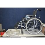 A DAYS WHEELCHAIR with two footrests, cushion and seperated wheel hoops