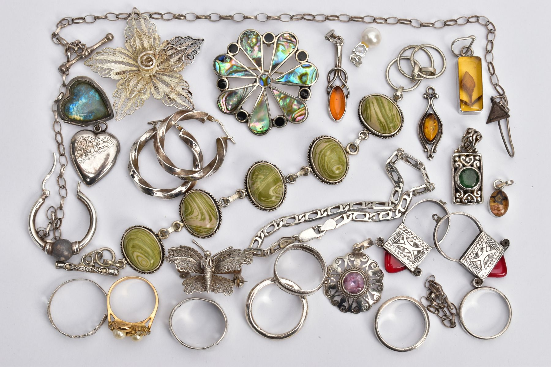 A BAG OF ASSORTED WHITE METAL JEWELLERY, to include a white metal line bracelet set with green and