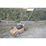 A VINTAGE QUALCAST PETROL LAWN MOWER with a Briggs and Stratton 3.5Hp engine (engine pulls freely