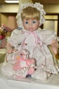 FOUR BOXED DANBURY MINT COLLECTORS DOLLS, each has its own toy and certificate, dolls are soft