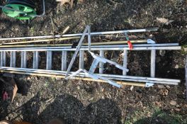 AN ALUMINIUM DOUBLE EXTENSION LADDER, and ladder stand-off, along with a selection of garden tools