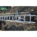 AN ALUMINIUM DOUBLE EXTENSION LADDER, and ladder stand-off, along with a selection of garden tools