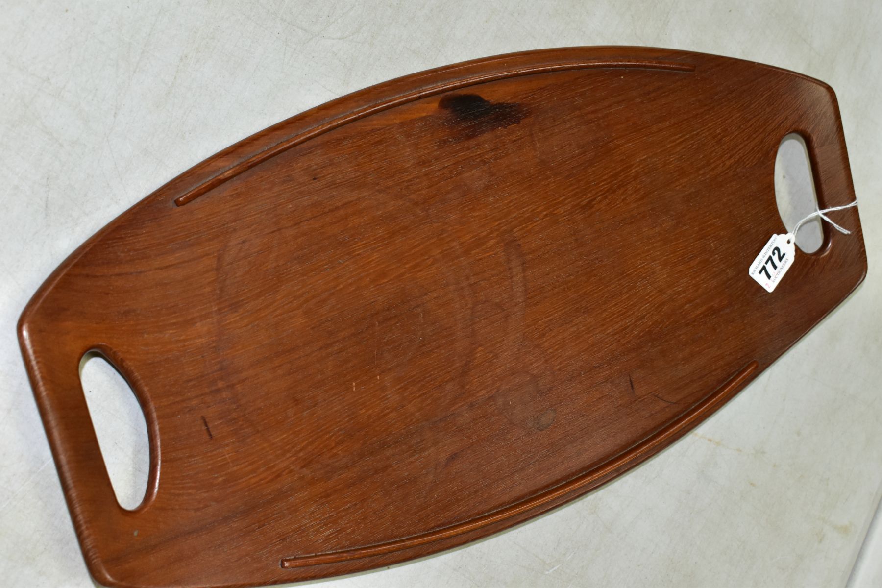 A 1960s DANSK TEAK TRAY, designed by Jens Quistgaard, an oval two handled tray, with side rails - Image 2 of 4