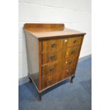 AN EARLY 20TH CENTURY WALNUT CHEST OF FOUR LONG DRAWERS, with a raised back, on cabriole legs, width