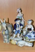 THREE CONTINENTAL CERAMIC FIGURINES, A GOAT FIGURE AND A BISQUE DOLL, comprising two Unter Weiss