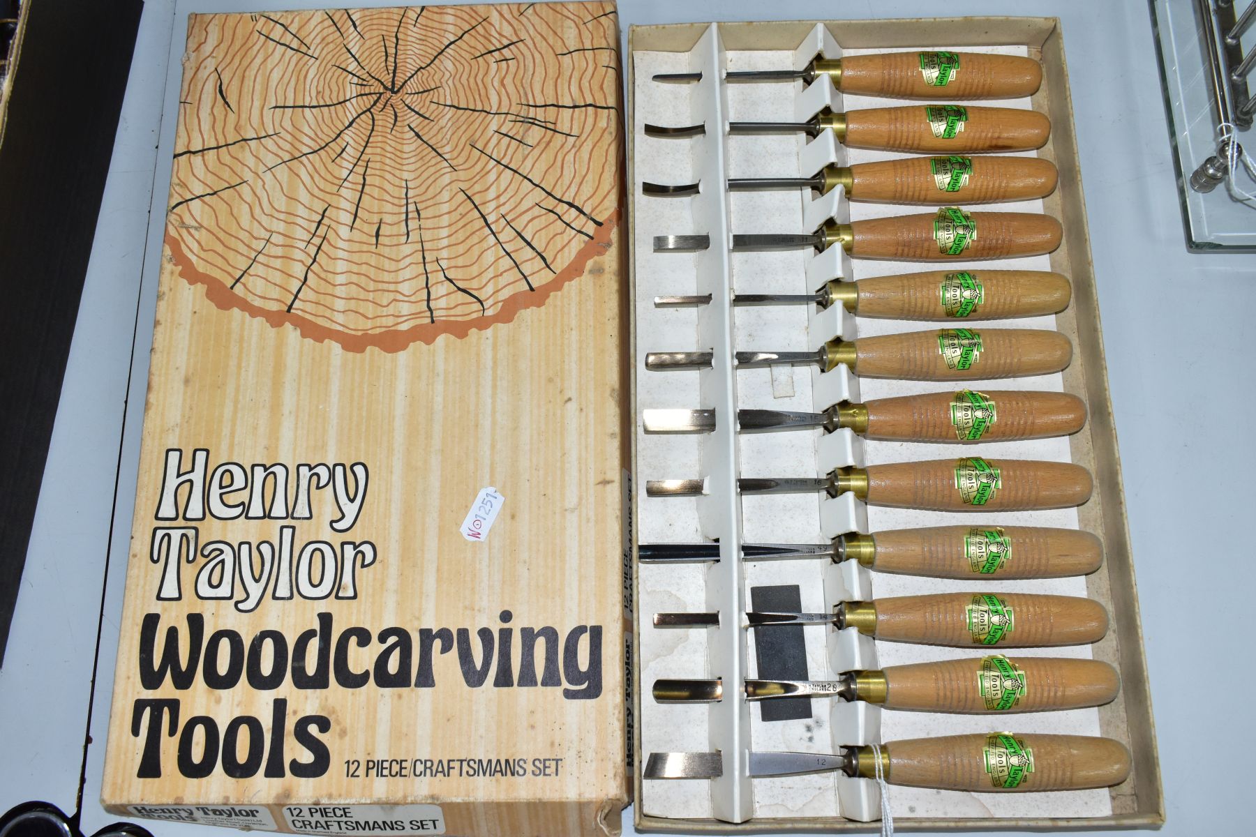 A BOXED HENRY TAYLOR WOODCARVING TOOLS 12 PIECE CRAFTSMANS SET, wooden handles each bearing