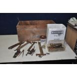 A VINTAGE WOODEN CRATE containing hand tools including tin snips, bit and brace, hand drills, a