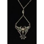 A PLIQUE A' JOUR BUTTERFLY NECKLACE, a white metal butterfly set with four circular cut rubies, a