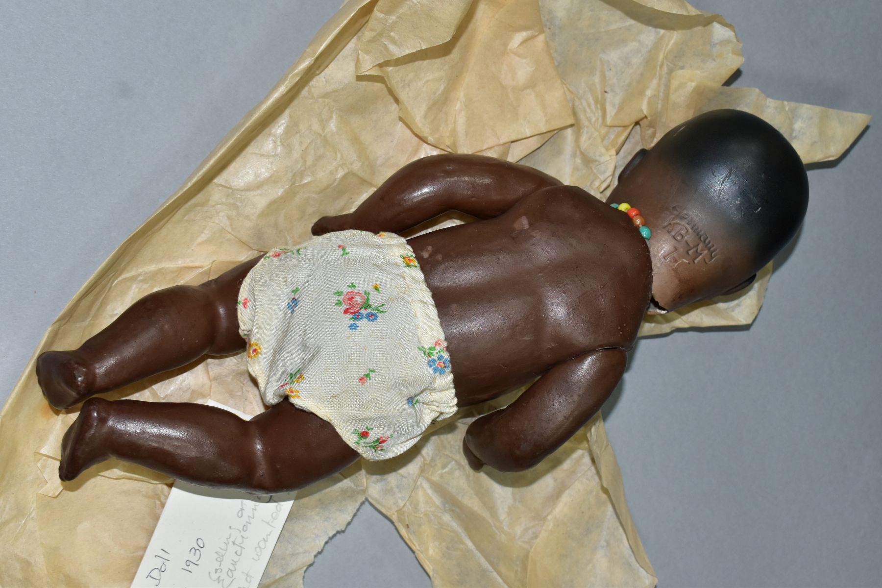 A GERMAN KB-M 1 BLACK BISQUE HEAD DOLL, composite body and bent limbs, sleeping eyes, pierced - Image 6 of 7