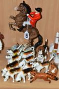 A BESWICK HUNTSMAN, HOUNDS AND FOXES, comprising huntsman on rearing horse, model no 868, style two,