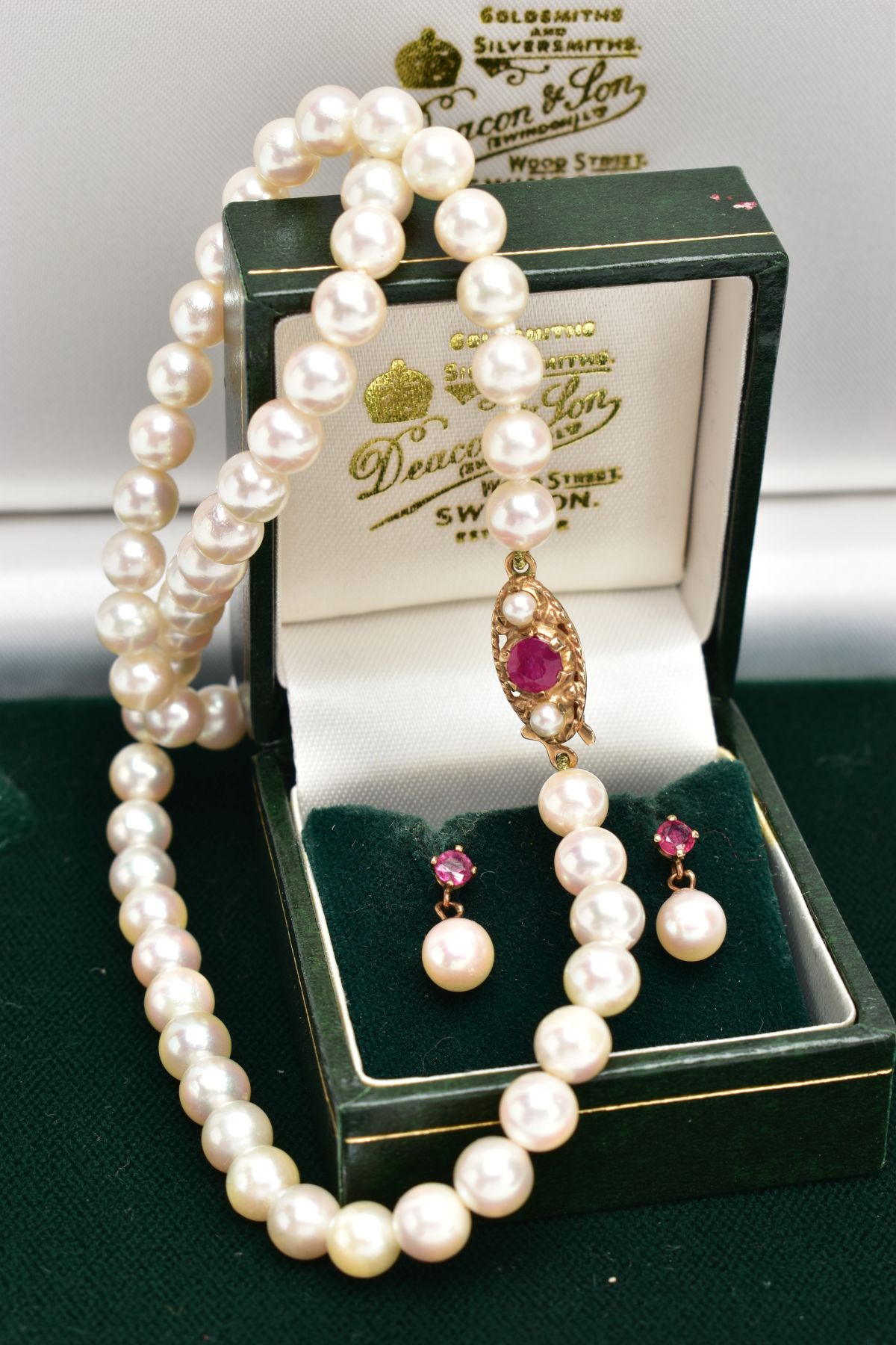A STRAND OF CULTURED PEARLS AND PAIR OF CULTURED PEARL EARRINGS, sixty five white pearls, each