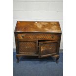 AN EDWARDIAN MAHOGANY AND INLAID BUREAU, front fall door enclosing various compartments, pigeon