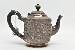 A LATE VICTORIAN SILVER TEAPOT, embossed floral and foliate design, fitted with an ebonised wooden