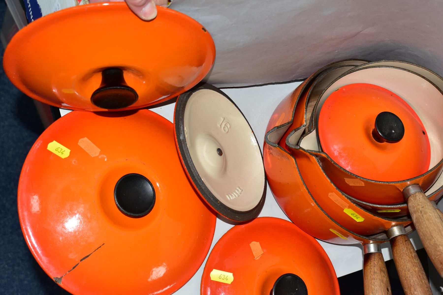 A GRADUATED SET OF FOUR LE CREUSET ORANGE ENAMEL SAUCEPANS AND LIDS, wooden handles, pouring lips, - Image 5 of 6