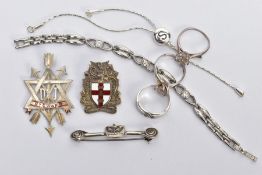 A BAG OF ASSORTED WHITE METAL ITEMS, to include a silver 'Steward' fob medal pendant, worn red