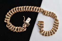 A 9CT GOLD BRACELET, double curb link yellow gold bracelet, approximate length 200mm x width 8mm,