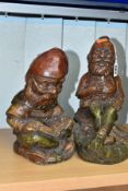 TWO CAST CONCRETE GARDEN GNOMES, one is a jovial laughing figure, the other is reading a book,