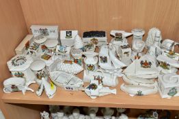 A COLLECTION OF APPROXIMATELY THIRTY FIVE PIECES OF CRESTED CHINA, including a Continental aeroplane