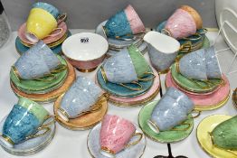 A SEVENTY TWO PIECE ROYAL ALBERT HARLEQUIN GOSSAMER PATTERN TEA SET, in assorted colours
