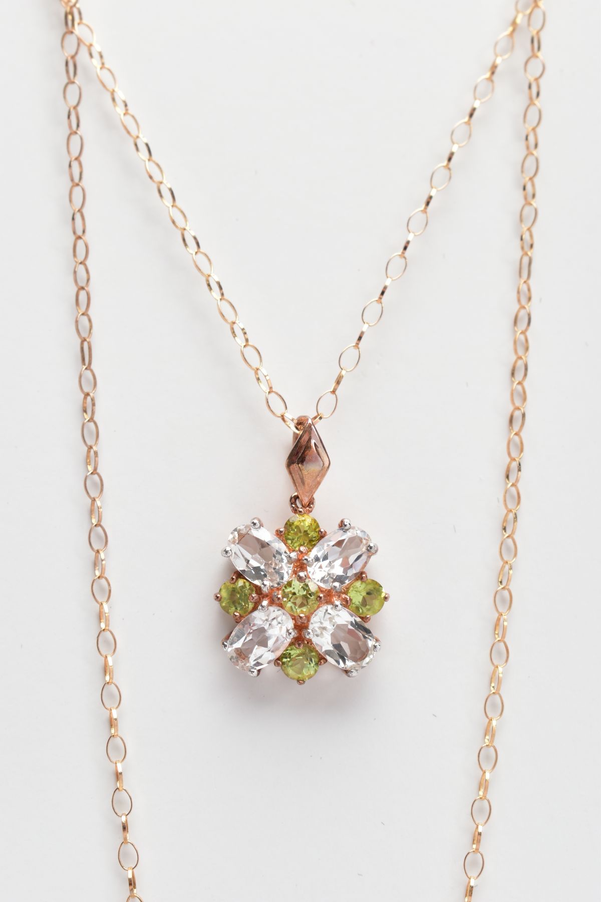 A 9CT GOLD GEM SET PENDANT NECKLACE, the pendant set with four colourless oval cut topaz and five - Image 2 of 2