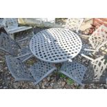 A MODERN CAST ALUMINIUM PATIO SET with a 107cm round pierced latticework top, parasol and base and