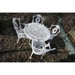A MODERN CAST ALUMINIUM GARDEN TABLE with a pierced foliate detailed round top 81cm in diameter, and