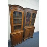 AN EDWARDIAN MAHOGANY TWO DOOR BOOKCASE, with a single drawer, width 77cm x depth 36cm x height