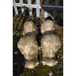 A PAIR OF COMPOSITE GARDEN FIGURES in the form of resting lions, both overpainted in gold, length