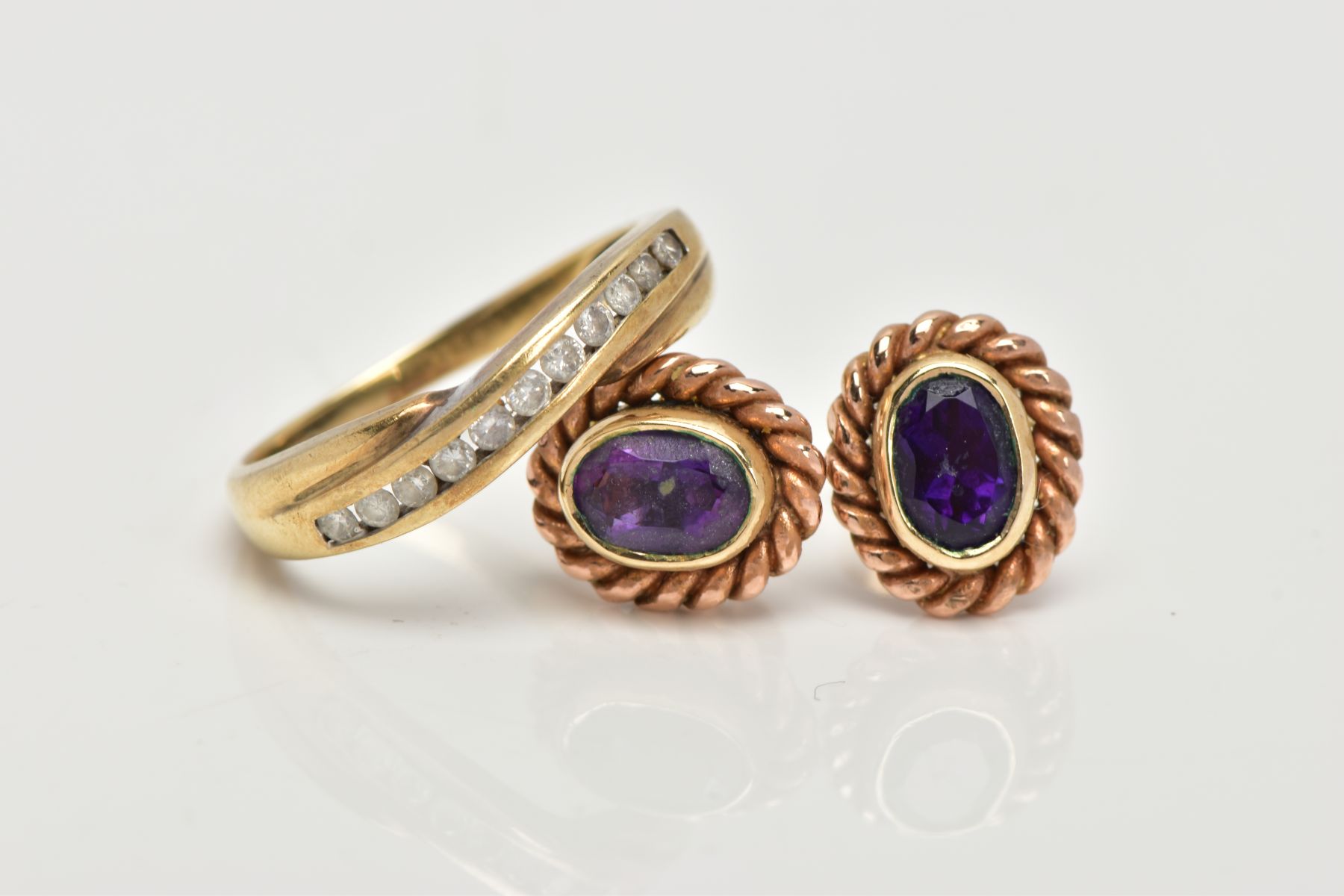 A 9CT GOLD DIAMOND HALF ETERNITY RING AND A PAIR OF 9CT GOLD AMETHYST EARRINGS, the ring of a