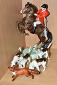A BESWICK HUNTSMAN ON REARING HORSE, model no 868, style two, brown gloss, impressed marks to